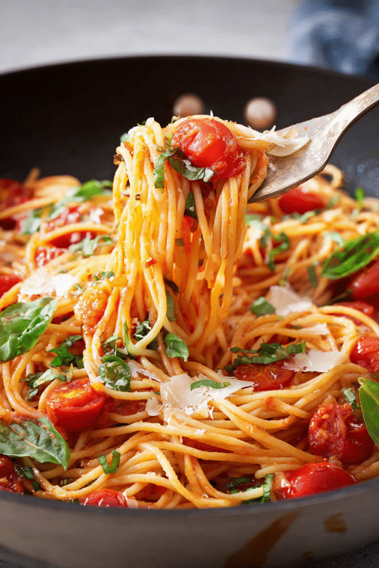 Spaghetti tossed with cherry tomatoes, fresh basil, and parmesan cheese in a light garlic sauce, served warm